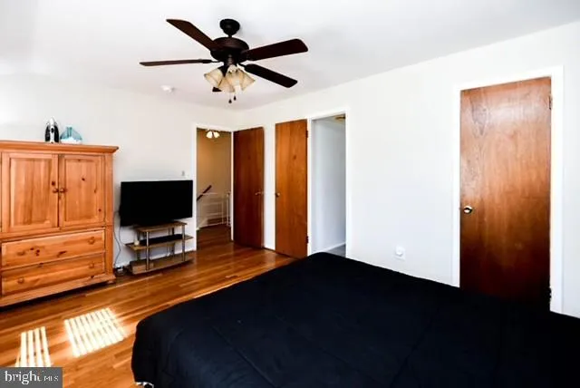 a bedroom with a bed and a flat tv screen