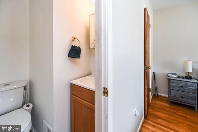 120 Old Enterprise Road, Unit 115 Upper Marlboro, MD 20774 - Photo 26 of 43 a bathroom with a toilet and a mirror