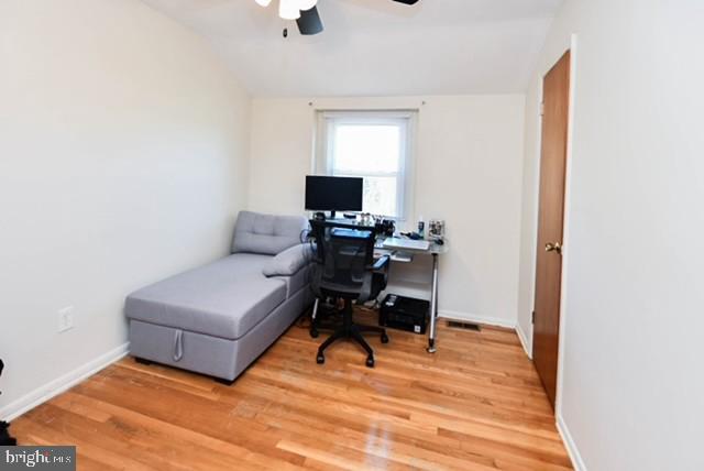 120 Old Enterprise Road, Unit 115 Upper Marlboro, MD 20774 - Photo 28 of 43 a living room with furniture and a wooden floor