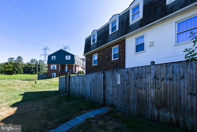 120 Old Enterprise Road, Unit 115 Upper Marlboro, MD 20774 - Photo 42 of 43 a view of a house with a yard