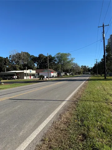 a view of a road with a yard