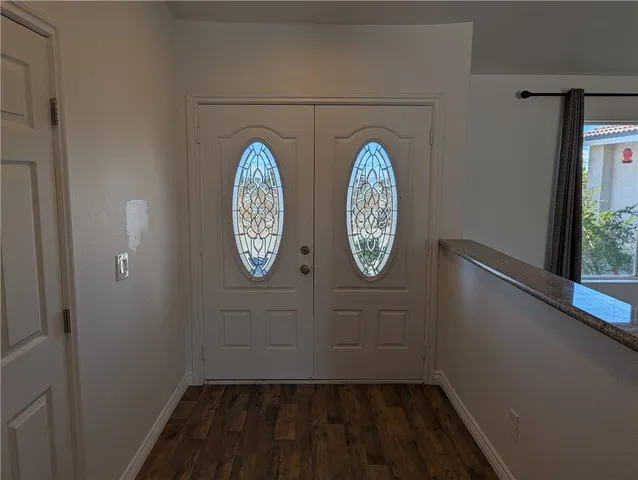 a view of washer and dryer with wooden floor