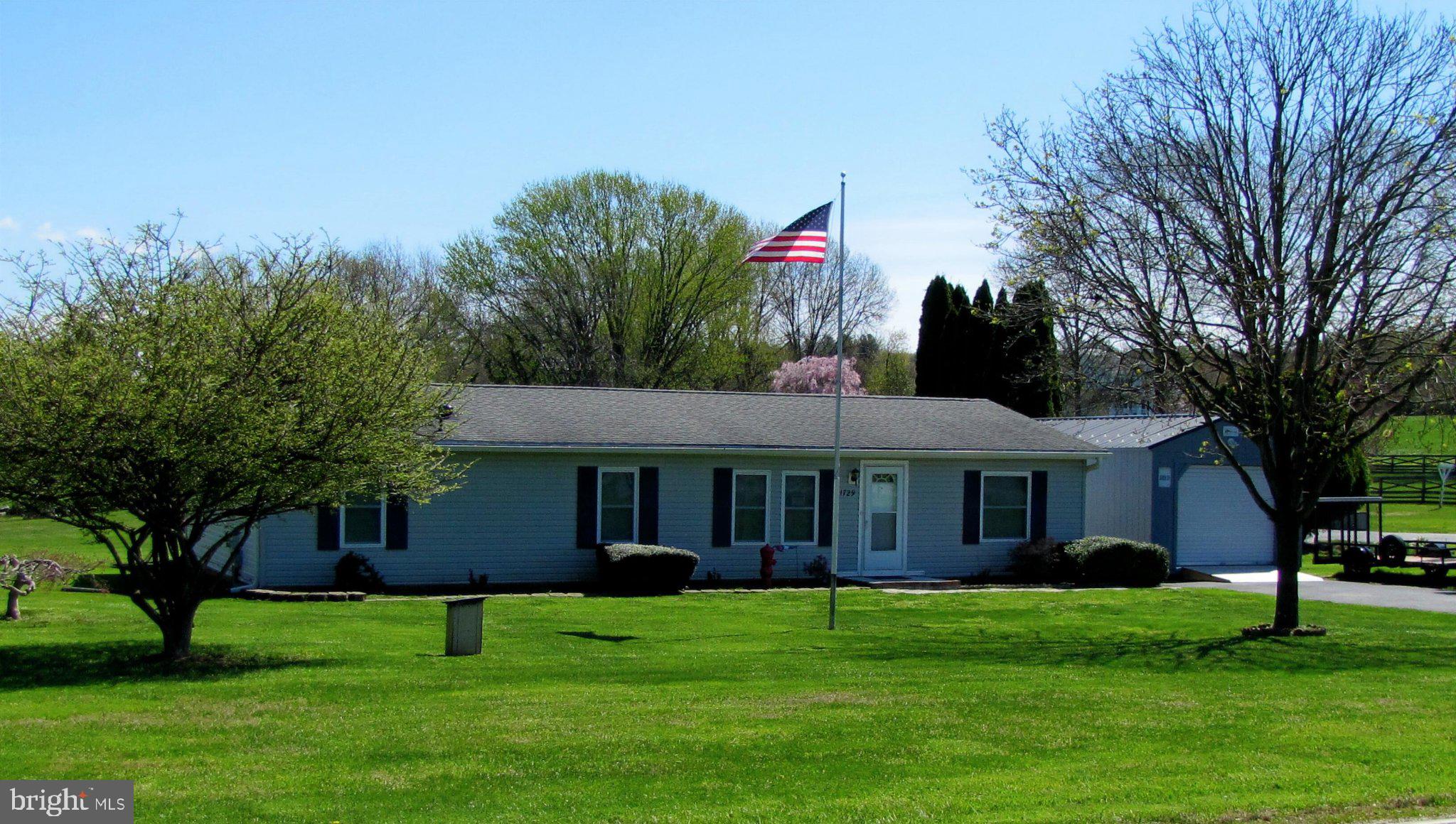 1729 Colora Road Colora, MD 21917 - Photo 2 of 21 Charming home with a flag in bloom.