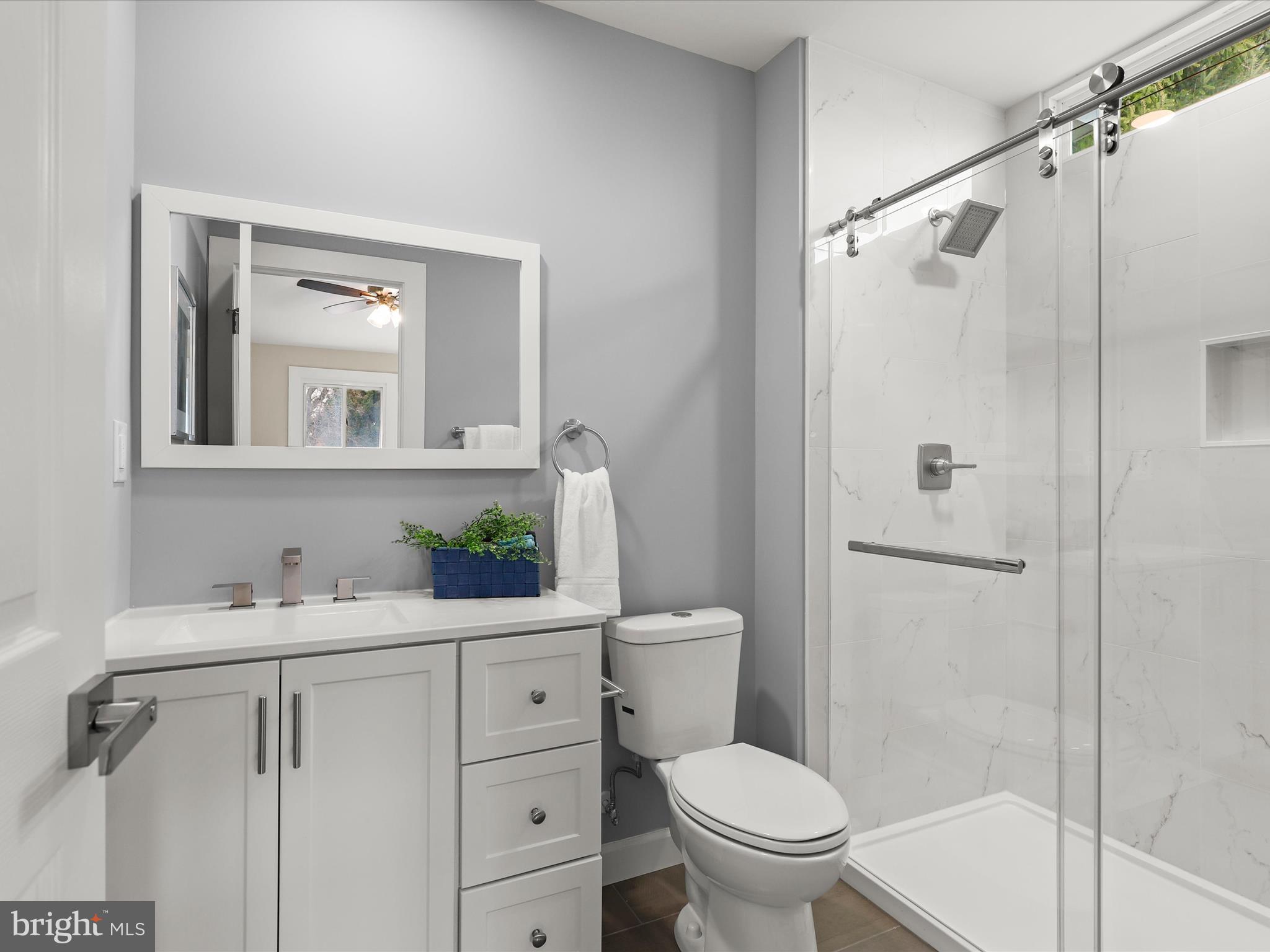 4708 Maryknoll Road Baltimore, MD 21208 - Photo 5 of 44 a bathroom with a sink toilet and shower