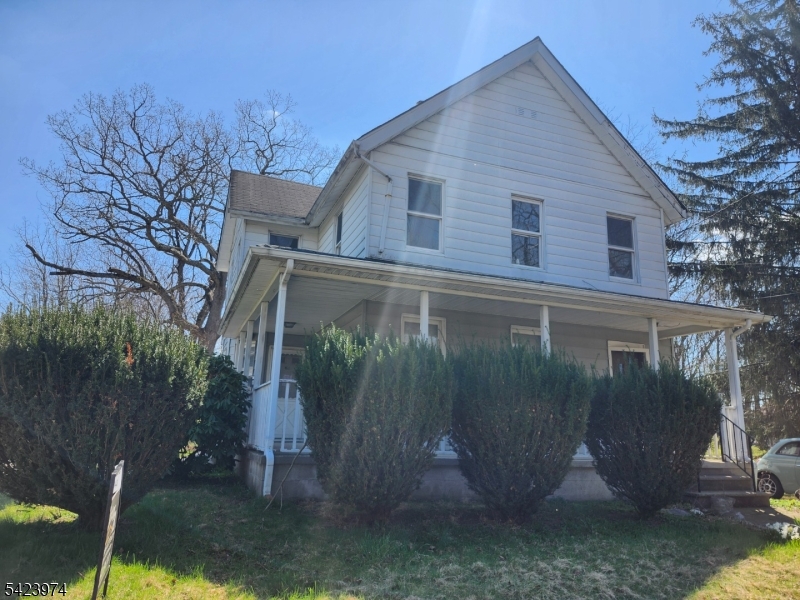 5 Locust Street Wanaque, NJ 07420 - Photo 3 of 23 a view of a small house