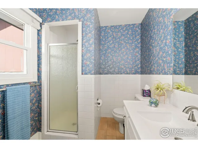 a bathroom with a sink a vanity and a mirror