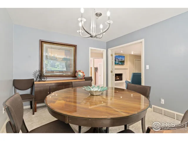 a dining room with table and chairs