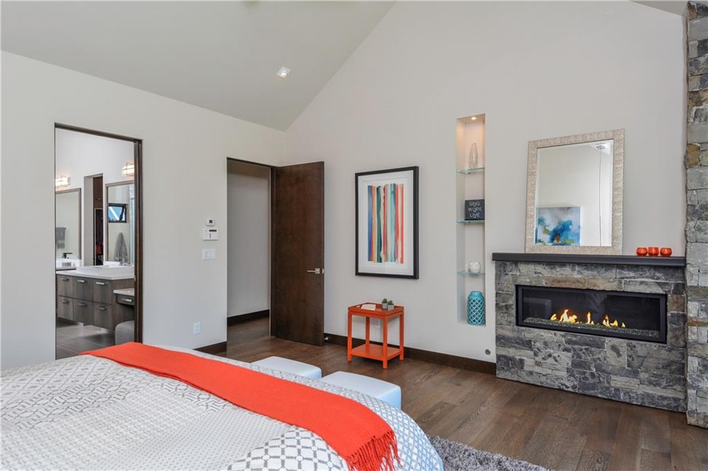 33 Rounds Road Breckenridge, CO 80424 - Photo 12 of 25 a bedroom with a bed and a fireplace