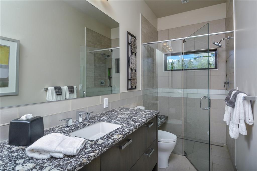 33 Rounds Road Breckenridge, CO 80424 - Photo 18 of 25 a bathroom with a granite countertop sink and a mirror