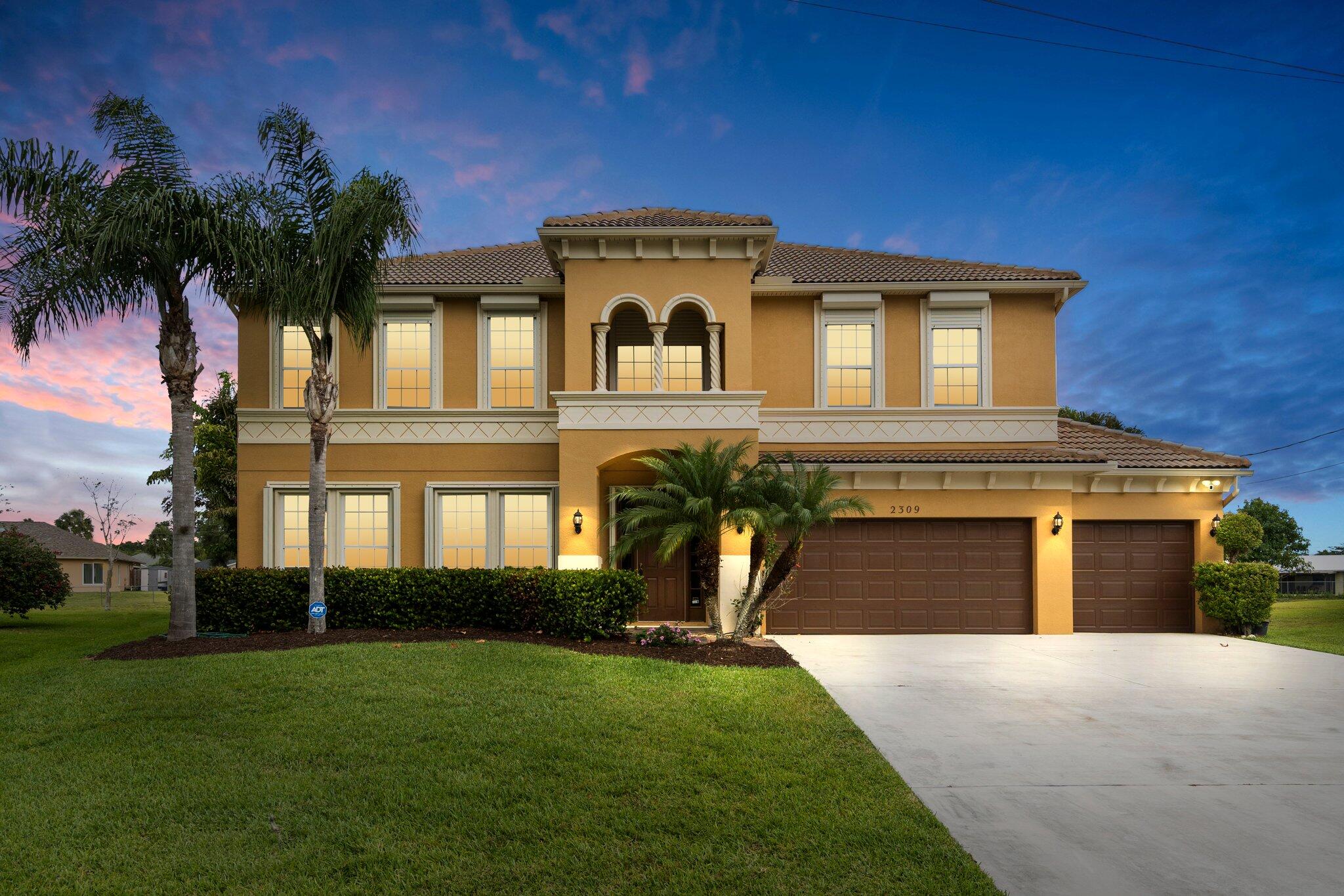 a front view of a house with a yard
