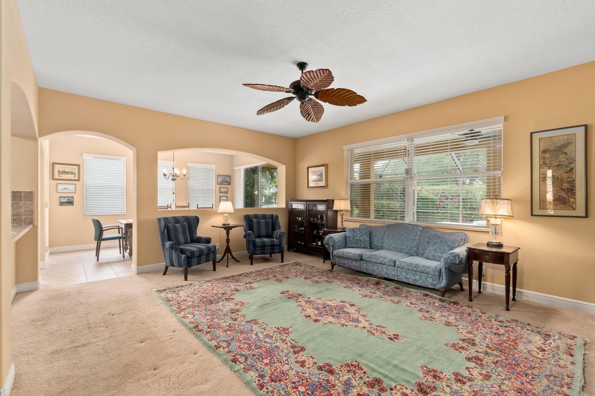 2309 Southwest Ivory Road Port St. Lucie, FL 34953 - Photo 15 of 46 a living room with furniture and a large window