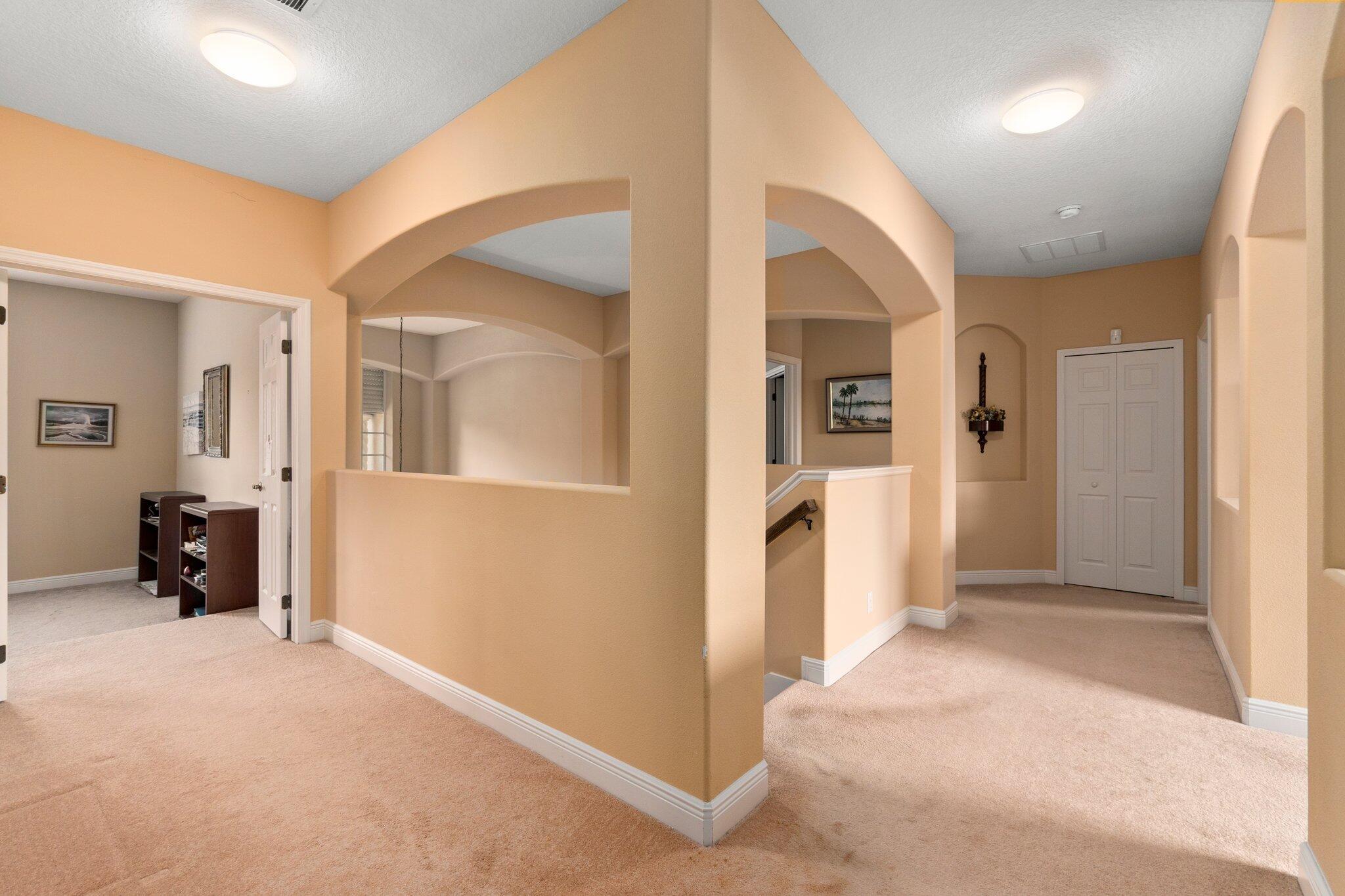 2309 Southwest Ivory Road Port St. Lucie, FL 34953 - Photo 21 of 46 a view of a livingroom with wooden floor and furniture