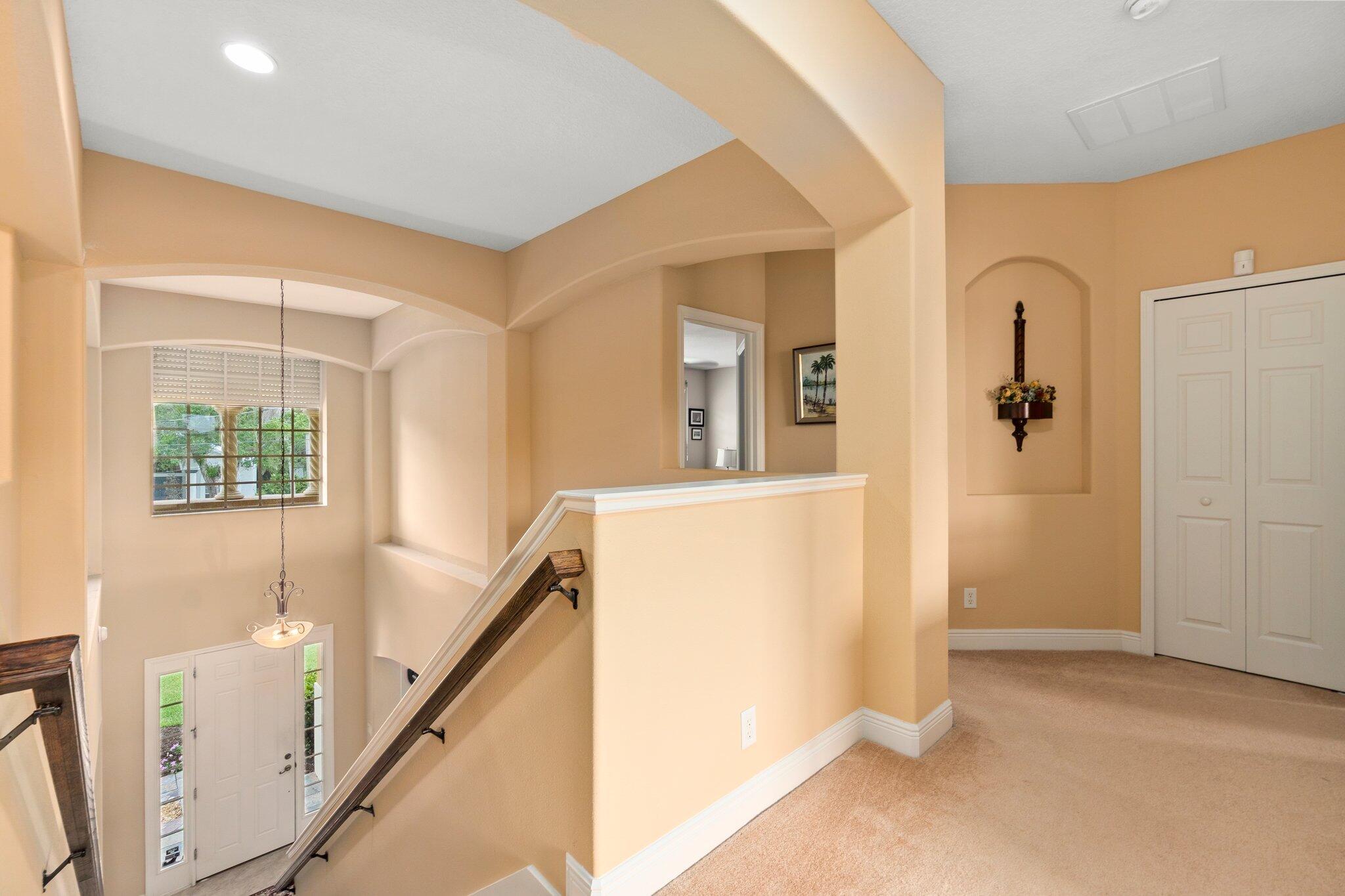 2309 Southwest Ivory Road Port St. Lucie, FL 34953 - Photo 22 of 46 a view of a hallway with windows and entryway