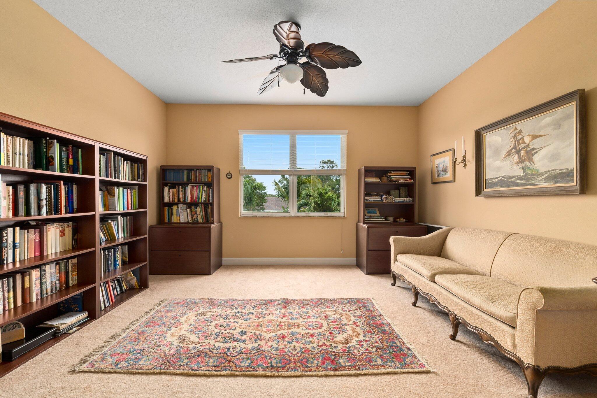 2309 Southwest Ivory Road Port St. Lucie, FL 34953 - Photo 23 of 46 a living room with furniture and a rug