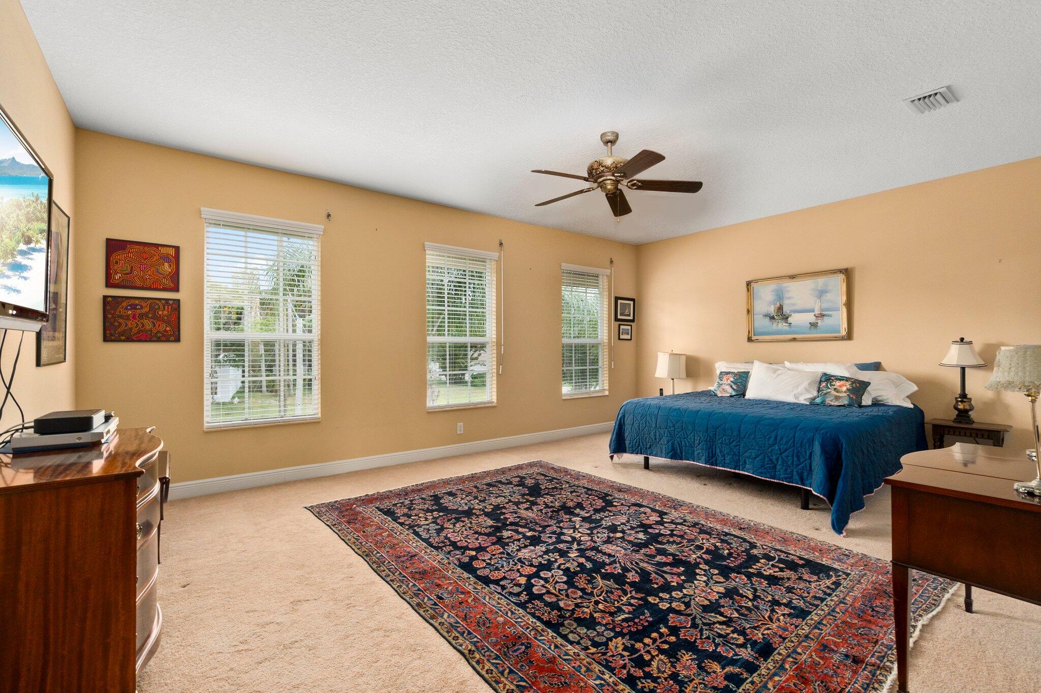 2309 Southwest Ivory Road Port St. Lucie, FL 34953 - Photo 25 of 46 a bedroom with furniture and windows