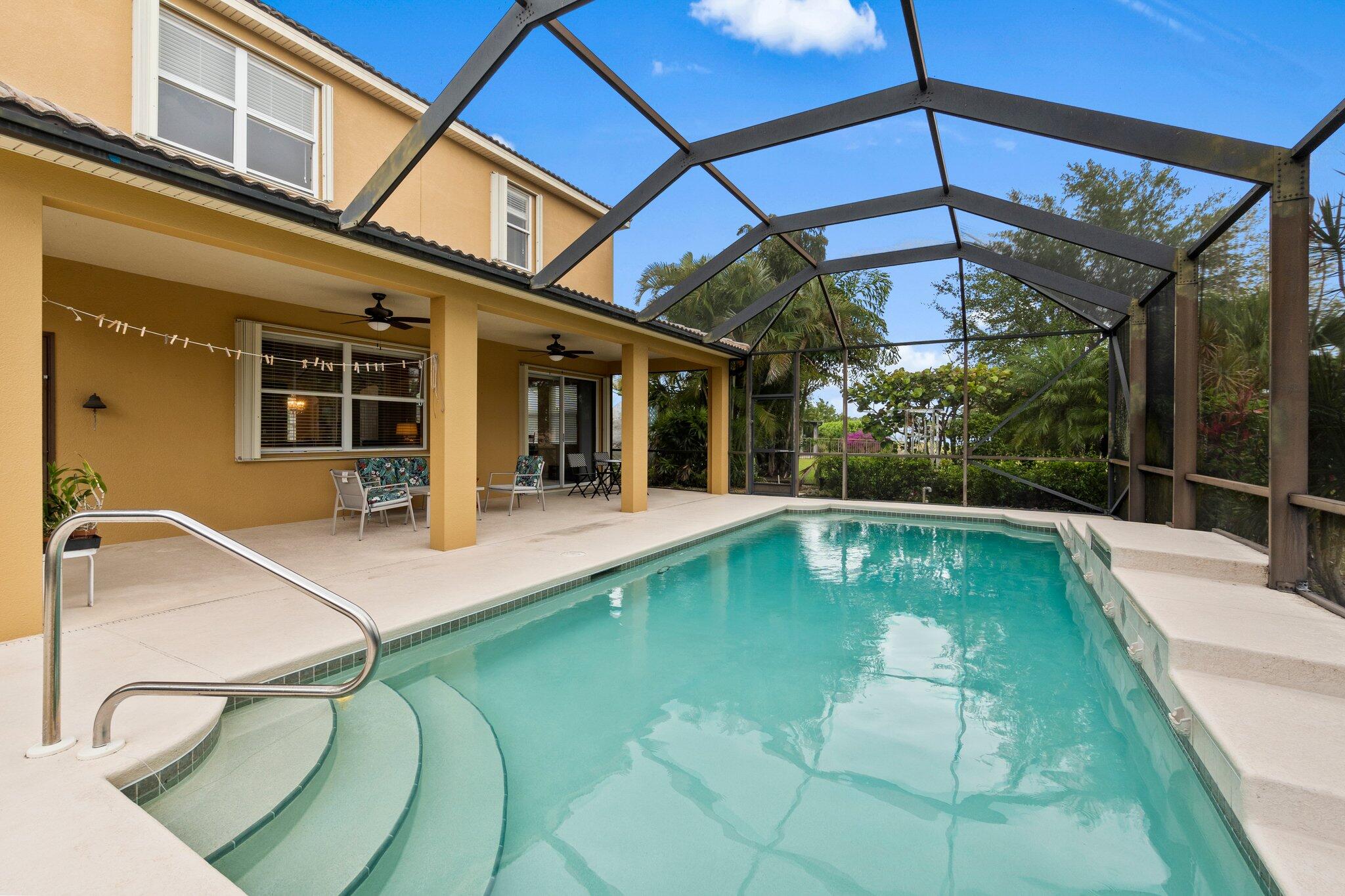 2309 Southwest Ivory Road Port St. Lucie, FL 34953 - Photo 35 of 46 a view of a backyard with swimming pool