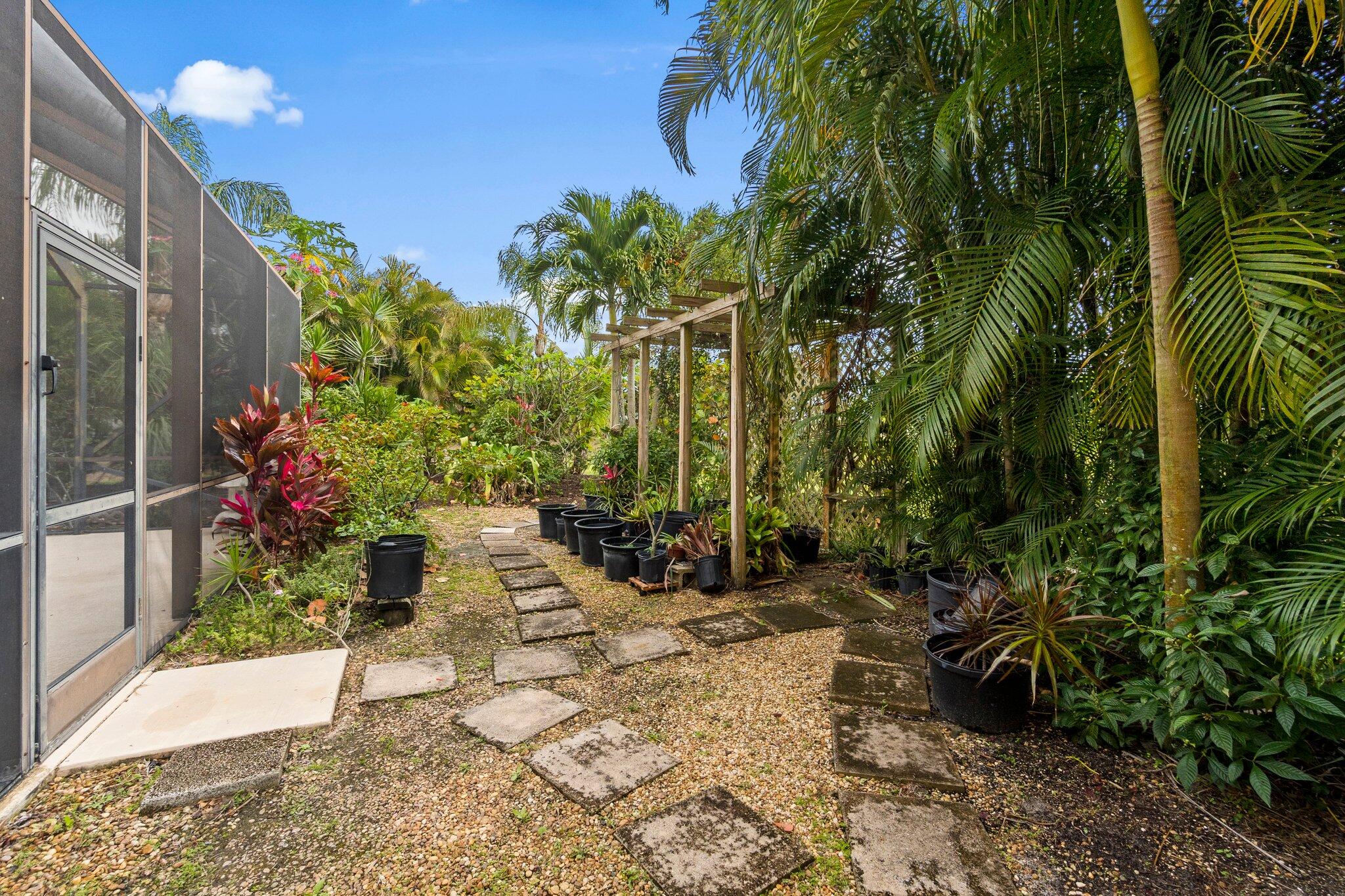 2309 Southwest Ivory Road Port St. Lucie, FL 34953 - Photo 39 of 46 a view of a pathway with a yard