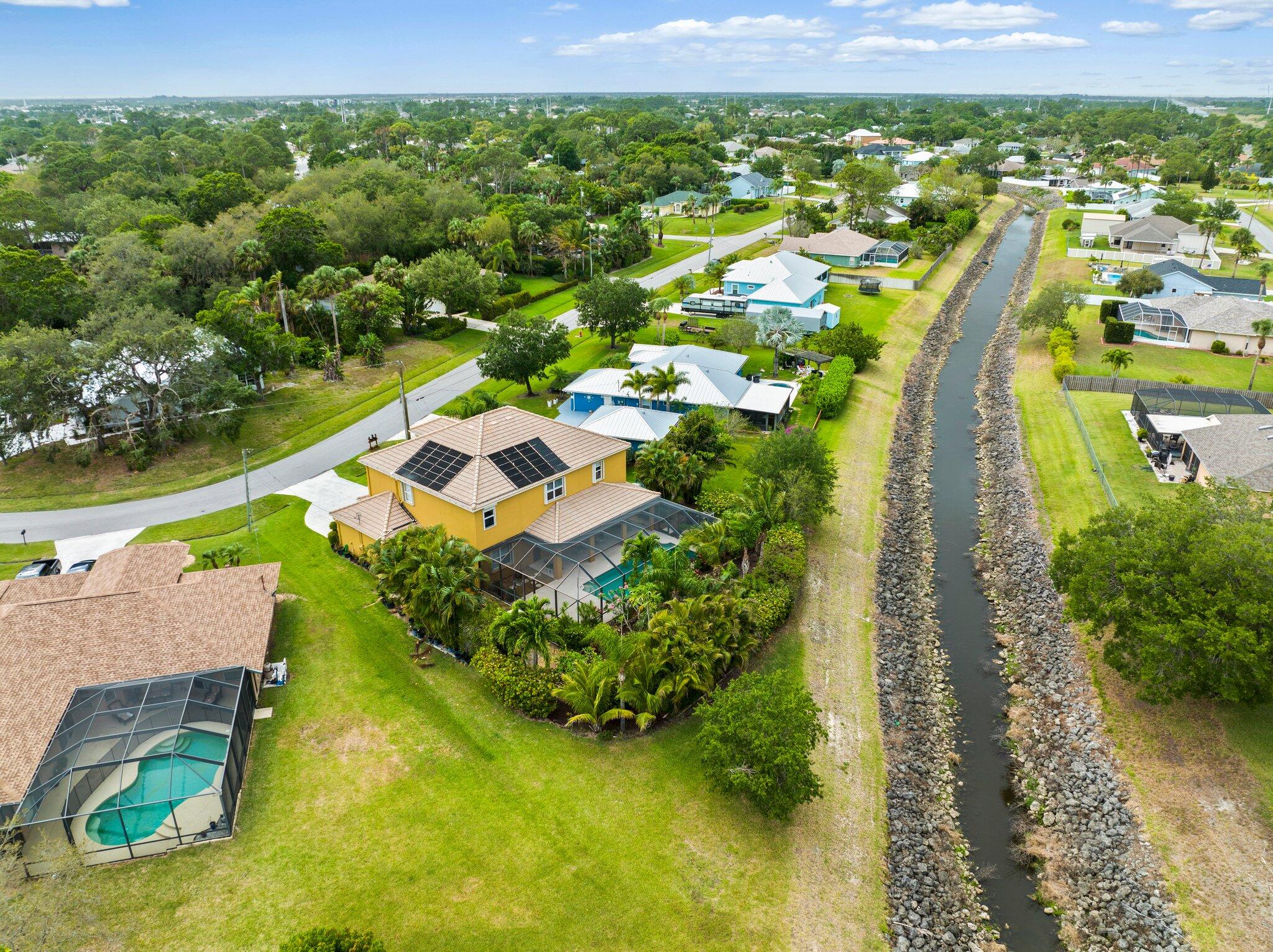 2309 Southwest Ivory Road Port St. Lucie, FL 34953 - Photo 46 of 46 an aerial view of residential houses with outdoor space and swimming pool