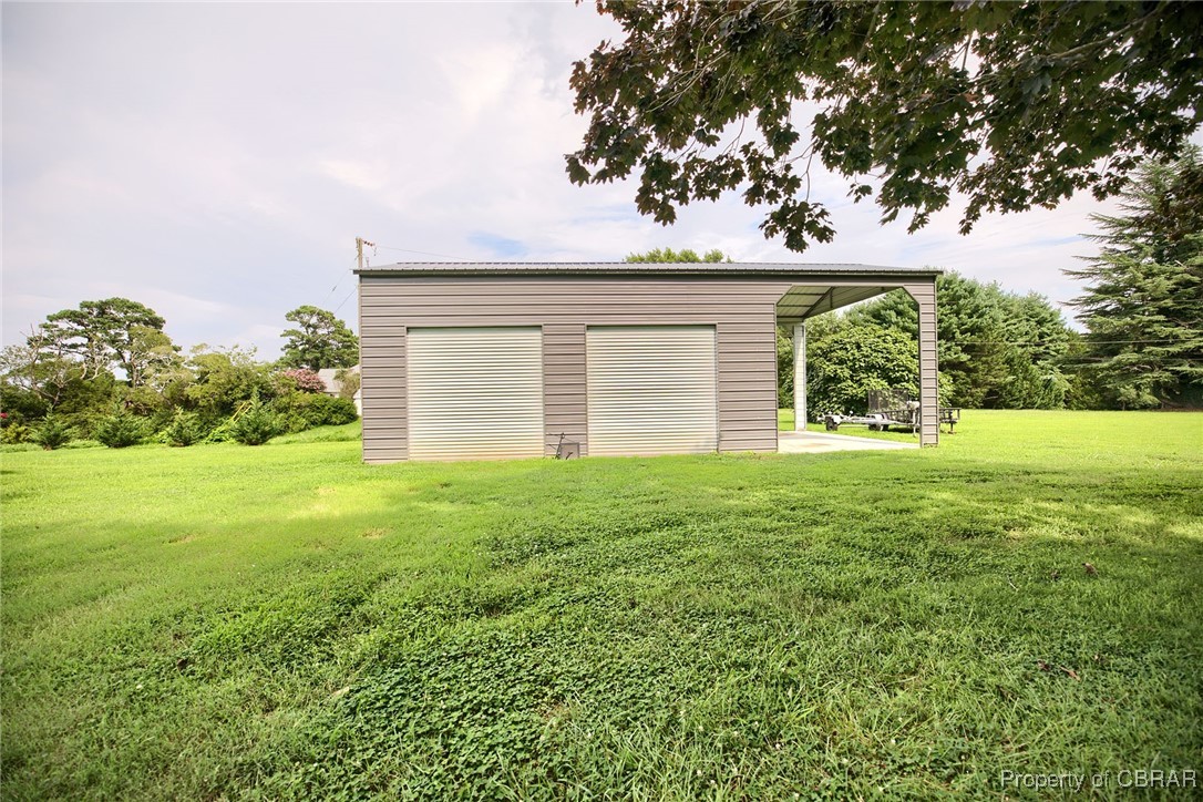 154 Twiggs Ferry Road Dutton, VA 23050 - Photo 17 of 50 Garage with a lawn
