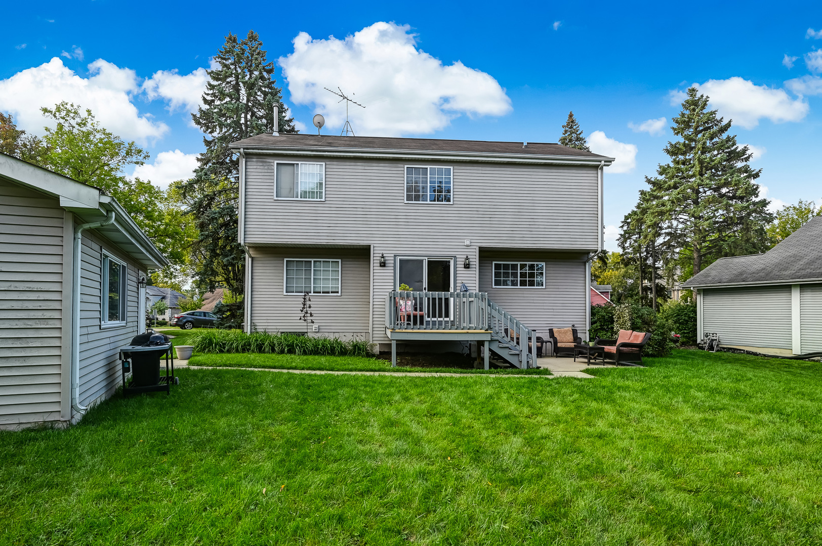 1934 Manning Road Darien, IL 60561 - Photo 14 of 14 a front view of a house with a garden and trees