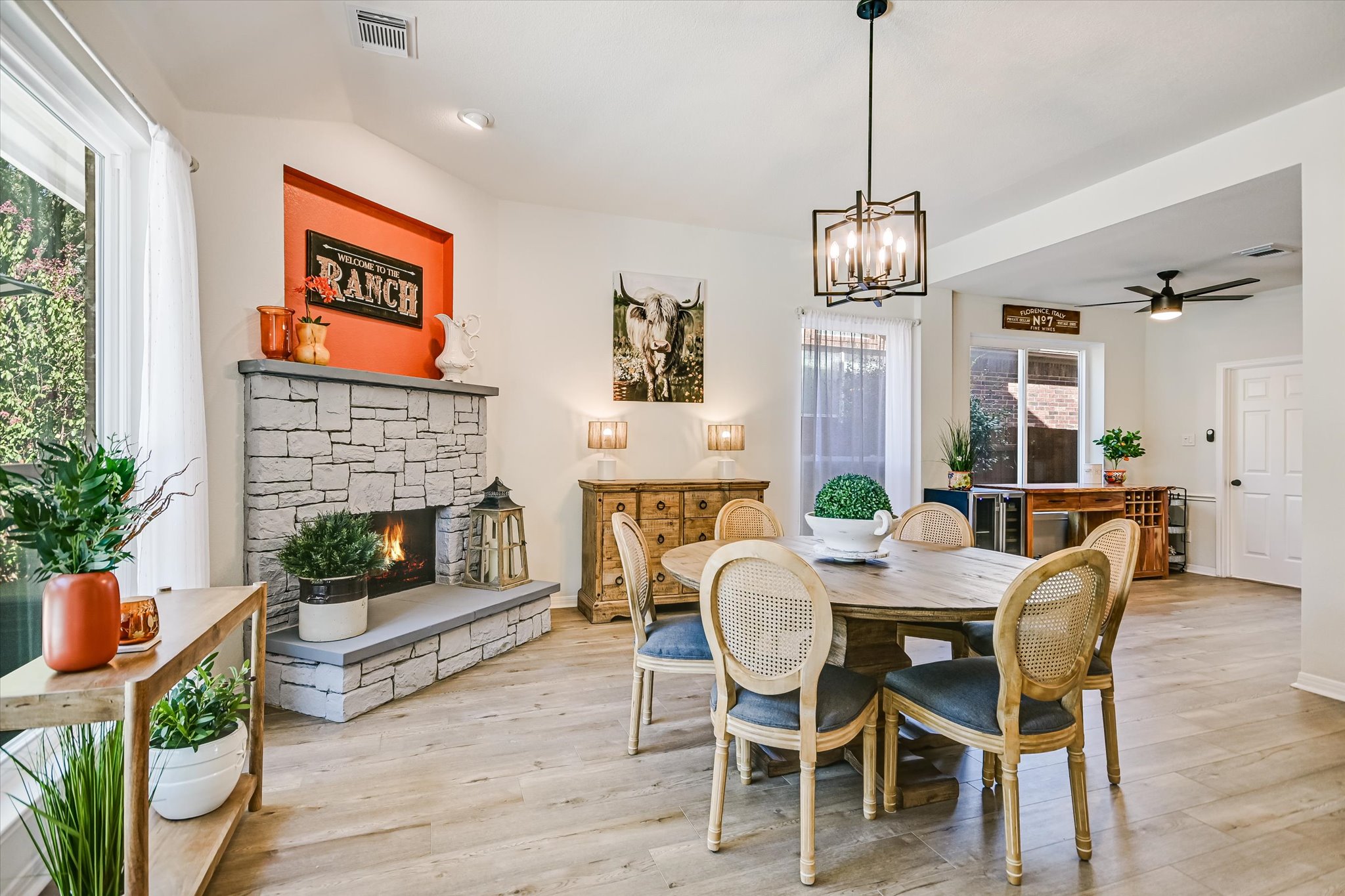 2900 Grimes Ranch Road Austin, TX 78732 - Photo 14 of 38 A fireplace adds charm and comfort to this spacious family room, making it ideal for relaxing or entertaining.