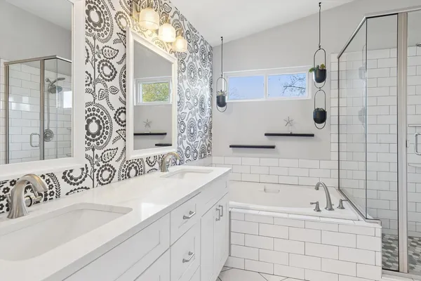 a bathroom with a bathtub and a sink