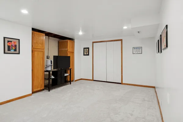 a view of room with workspace and a window