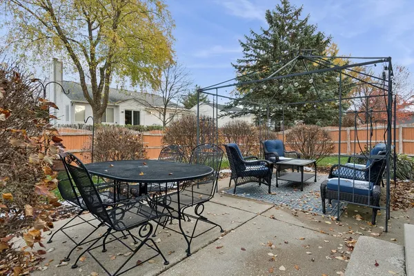 a view of a backyard with sitting area