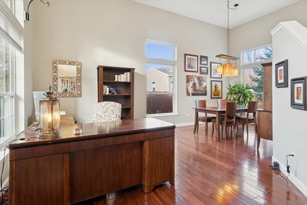 a room with wooden floors and wooden cabinets