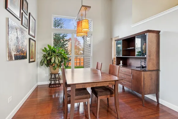 a view of a dining room with furniture and wooden floor