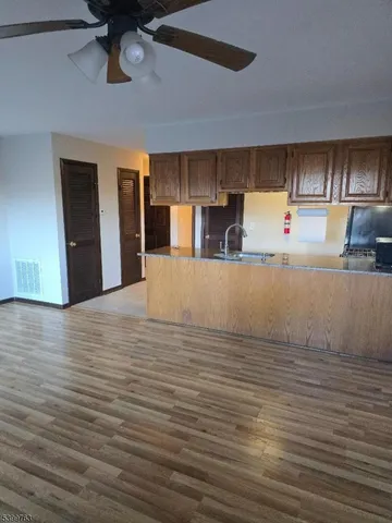 a view of a kitchen with a sink