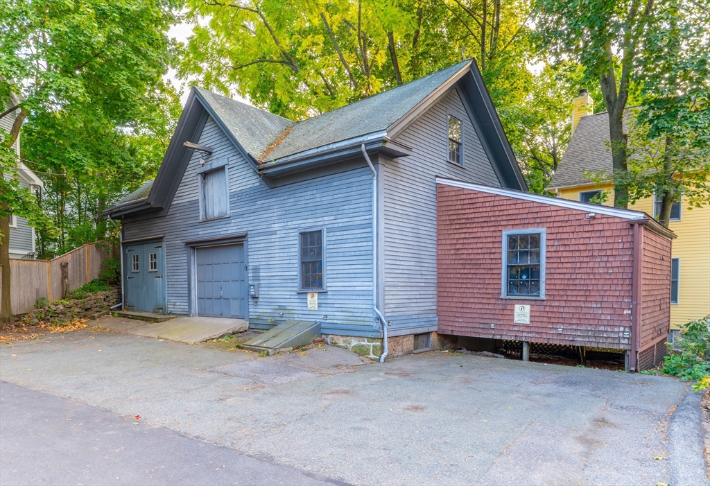 12 Thayer Street Brookline, MA 02445 - Photo 2 of 12 a front view of a house with a garage