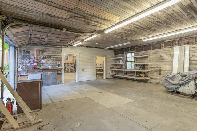 a view of a livingroom with table and chair