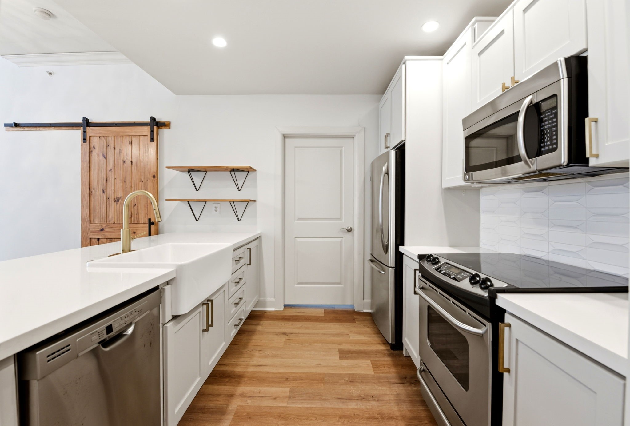 1010 Rosine Street, Unit 43 Houston, TX 77019 - Photo 11 of 48 a kitchen with stainless steel appliances a sink stove and refrigerator