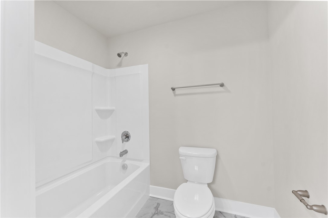 167 Tiger Lily Drive Anderson, SC 29621 - Photo 17 of 34 A well-appointed bathroom offers a clean tub and shower combination with practical features.