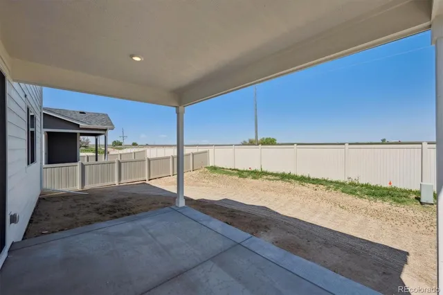 a view of a living room and kitchen