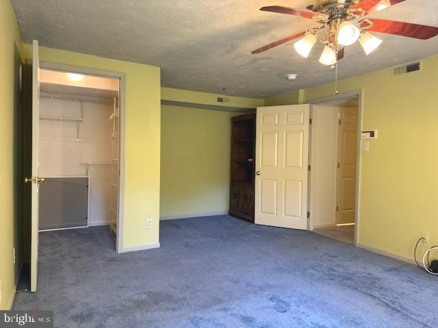 1 Inverness Circle Marlton, NJ 08053 - Photo 11 of 19 a view of an empty room with a chandelier fan