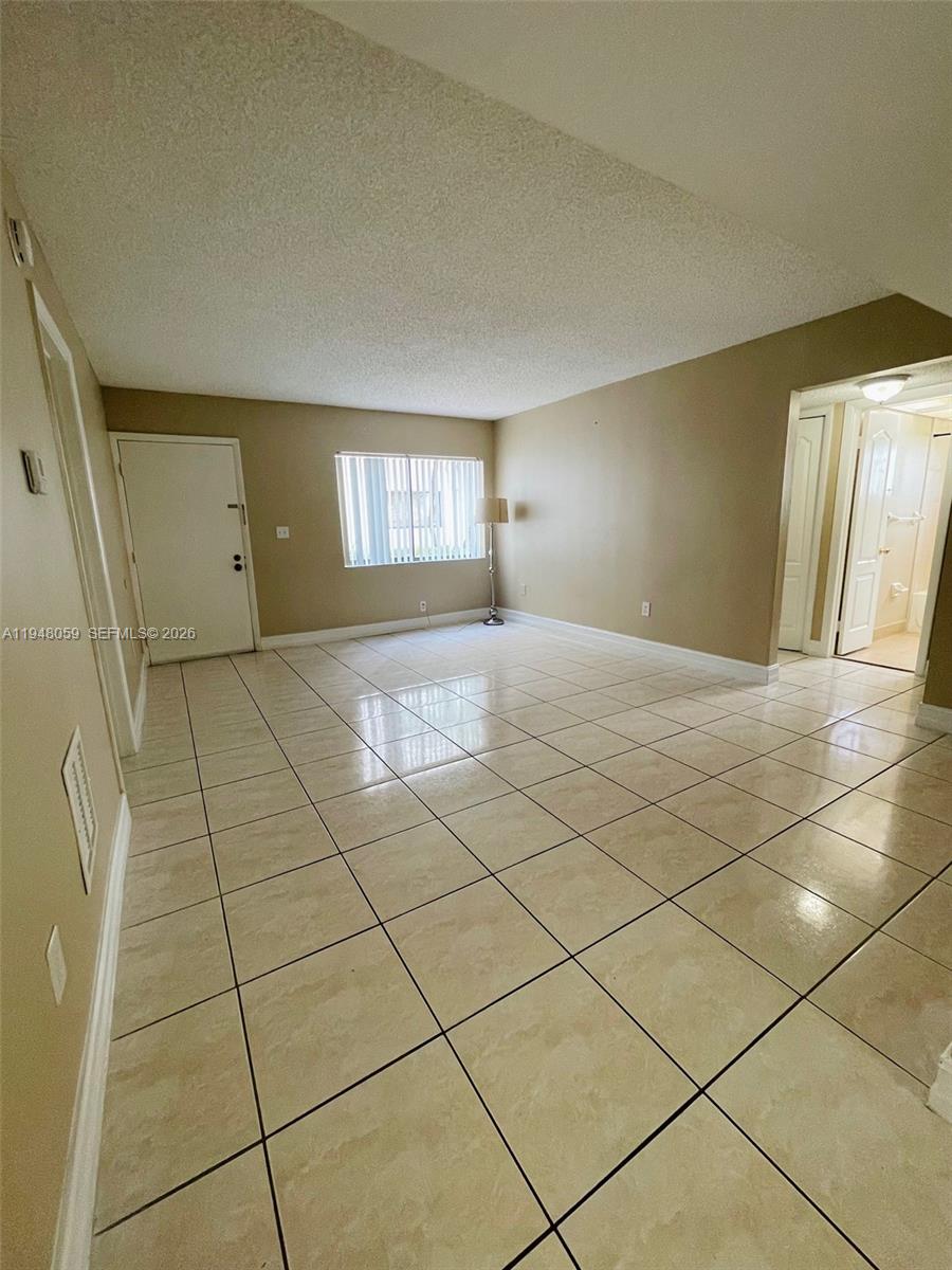 8400 Southwest 133rd Avenue Road, Unit 107 Miami, FL 33183 - Photo 12 of 21 a view of an empty room and window