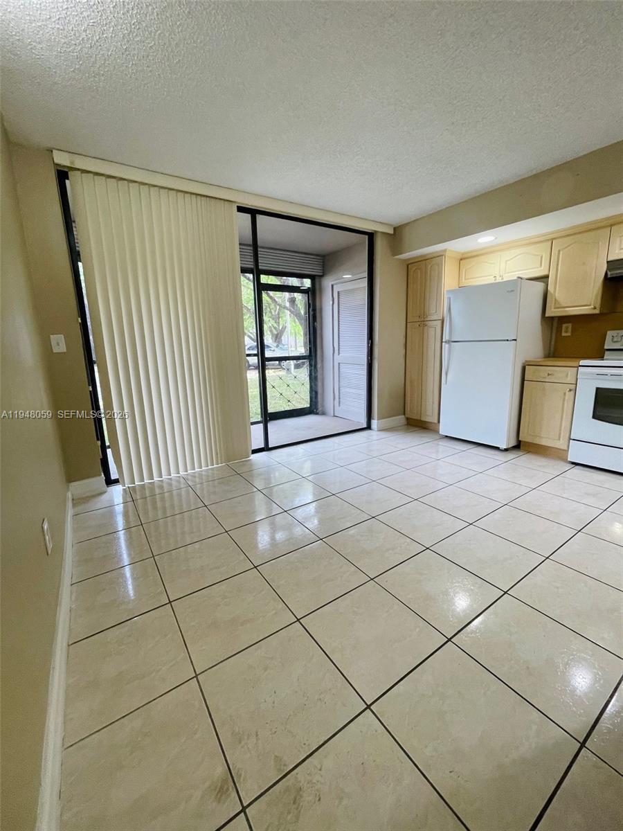 8400 Southwest 133rd Avenue Road, Unit 107 Miami, FL 33183 - Photo 14 of 21 a view of a livingroom with a fireplace and window