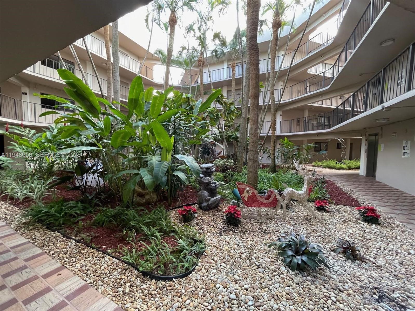 8400 Southwest 133rd Avenue Road, Unit 107 Miami, FL 33183 - Photo 19 of 21 a view of a house with a garden