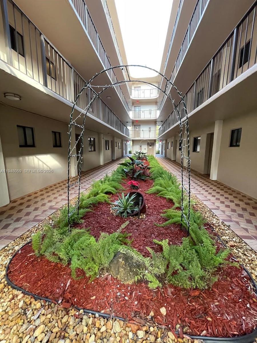 8400 Southwest 133rd Avenue Road, Unit 107 Miami, FL 33183 - Photo 21 of 21 a front view of a house with a yard