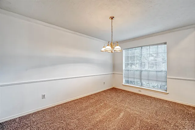 a kitchen with white cabinets appliances and a sink