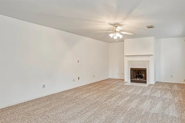 a kitchen with cabinets appliances a sink and a counter top space