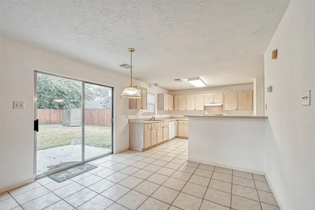 an empty room with a ceiling fan