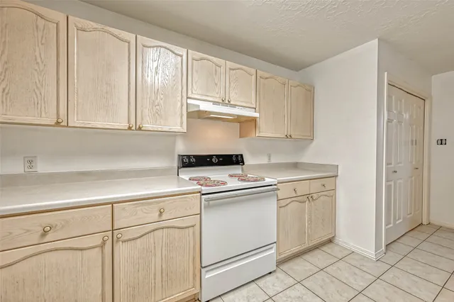 a view of backyard with swimming pool and trees in the background