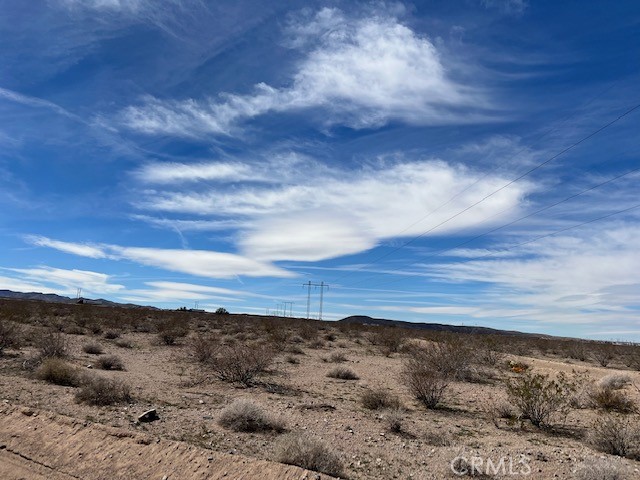 0 Camp Rock Road Daggett, CA 92327 - Photo 5 of 12 a view of a dry yard with wooden fence