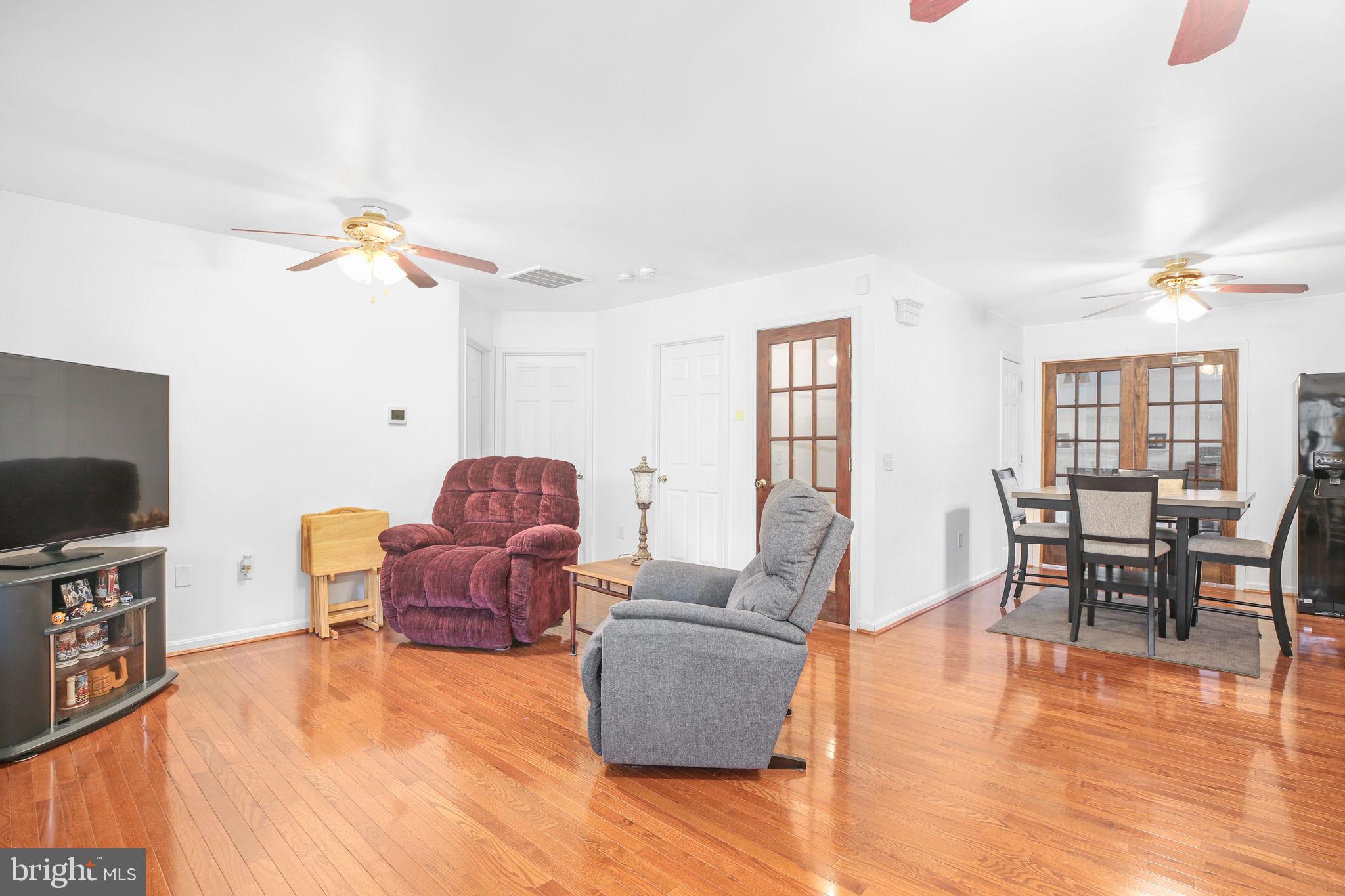 315 Sandy Ridge Road Fredericksburg, VA 22405 - Photo 11 of 42 a living room with furniture and a flat screen tv