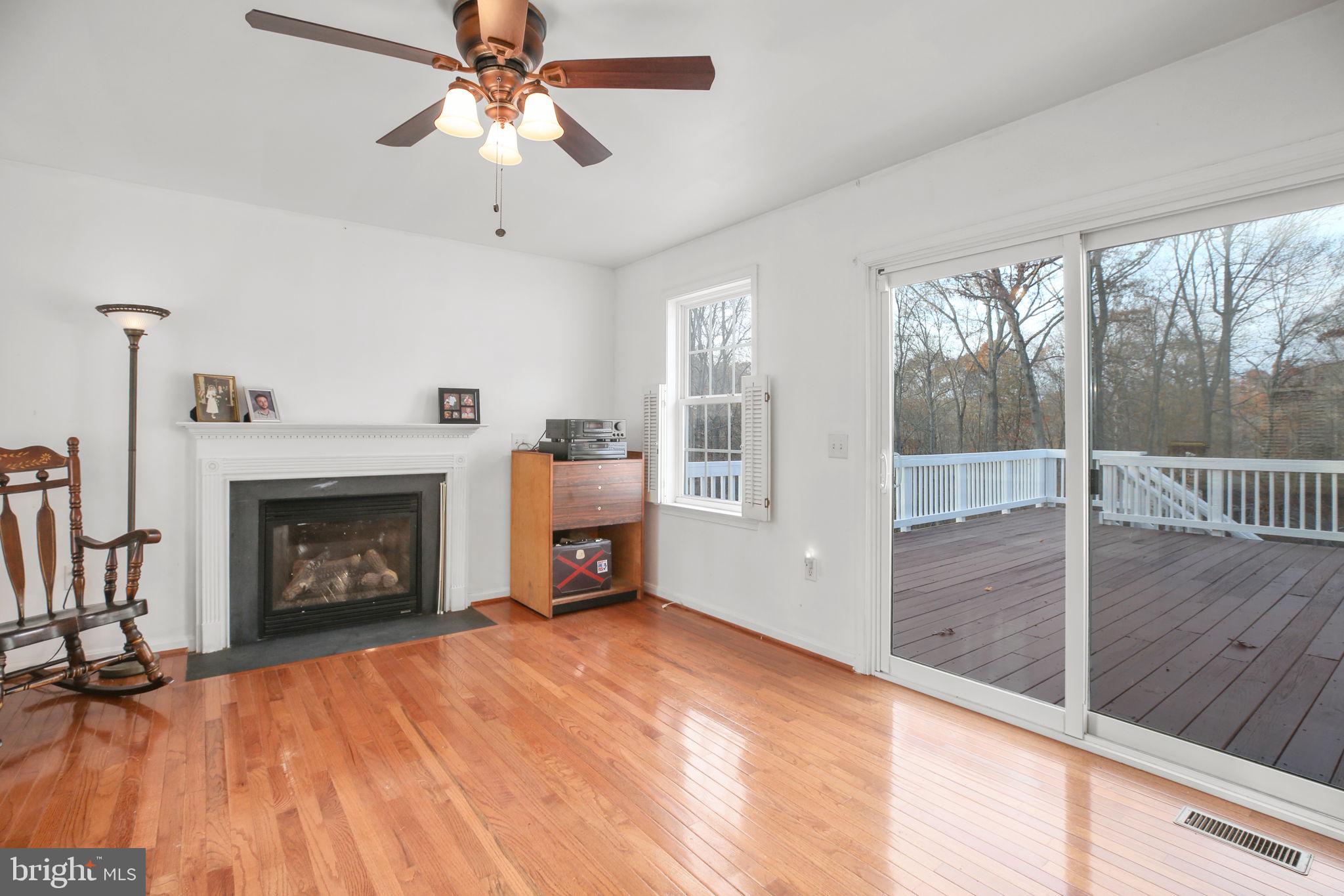 315 Sandy Ridge Road Fredericksburg, VA 22405 - Photo 14 of 42 a view of empty room with fireplace and fan