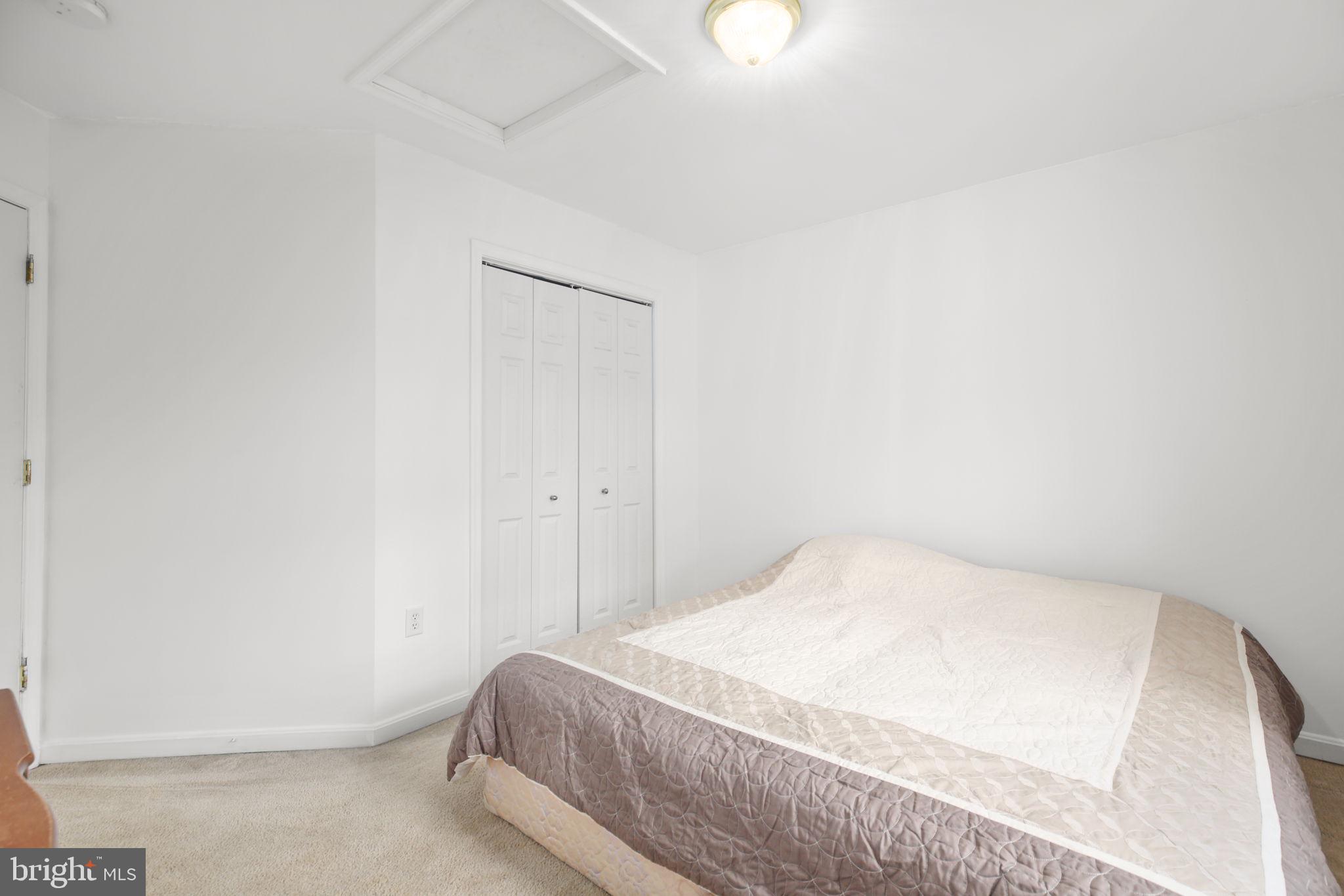 315 Sandy Ridge Road Fredericksburg, VA 22405 - Photo 20 of 42 a bedroom with a bed and a window