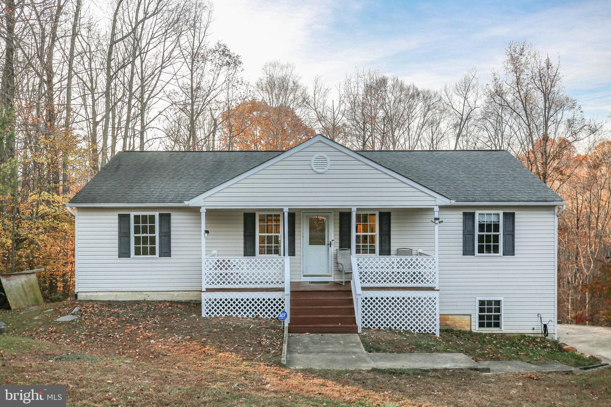 315 Sandy Ridge Road Fredericksburg, VA 22405 - Photo 2 of 42 a front view of a house with a yard
